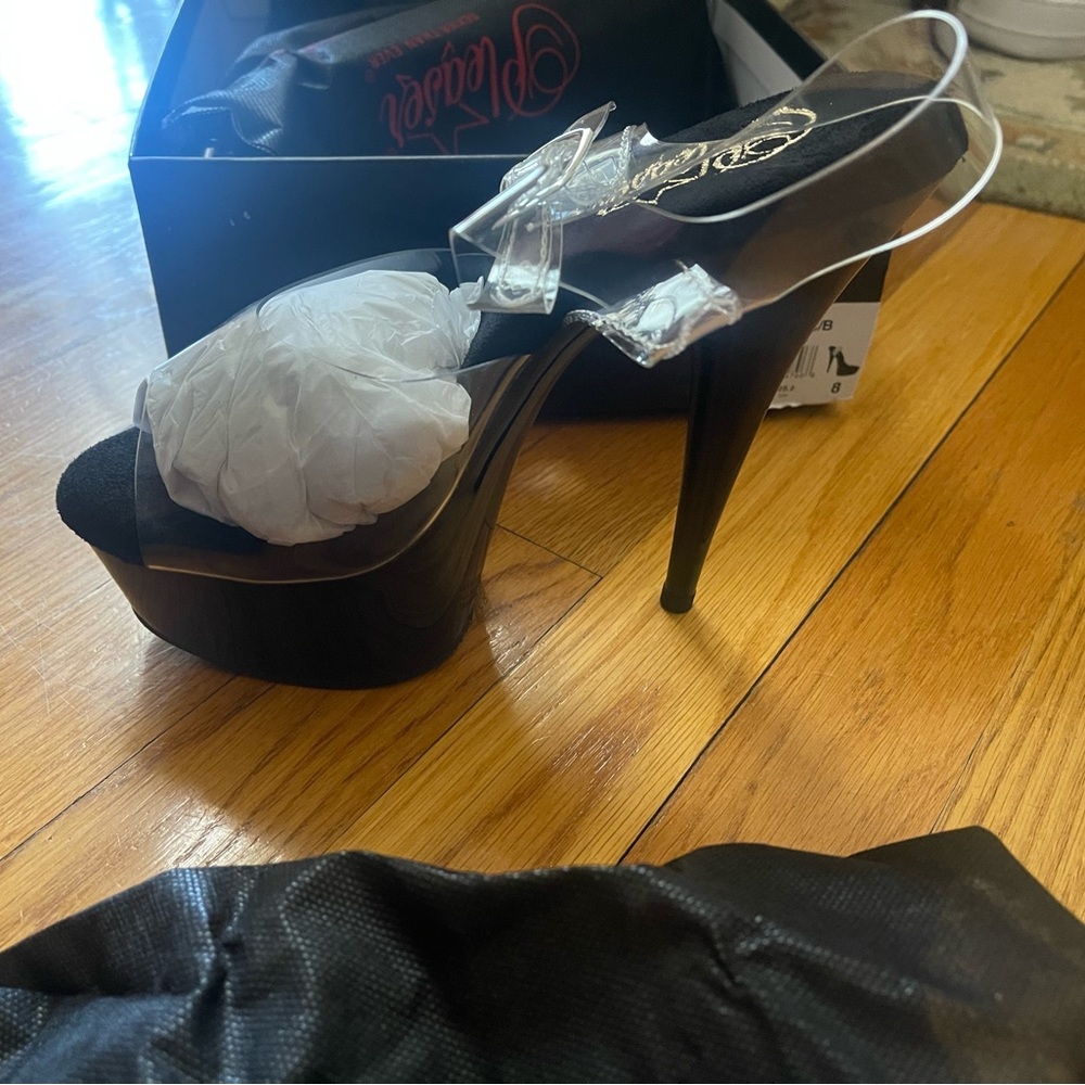 Pleaser platform shoes Size 8.  Clear straps.  Black bottom.  Brand new.
